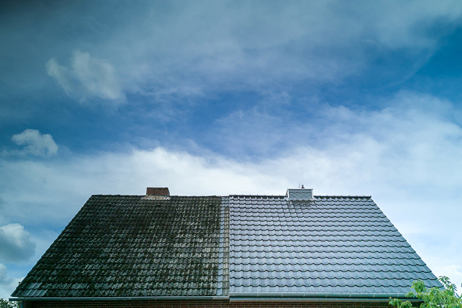front house roof view with one side cleaned and one side dirty tallahassee fl