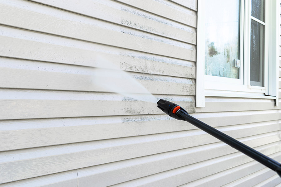 side of house being pressure washed